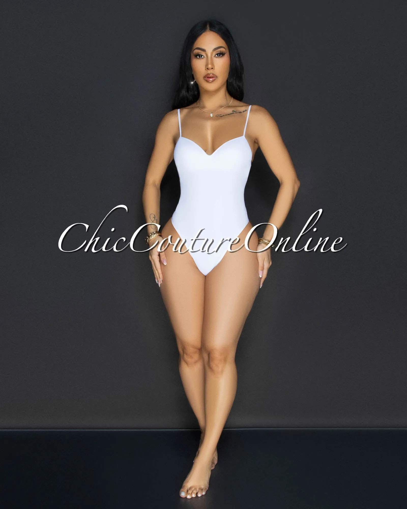 Toniya White Ribbed Body-Con Bodysuit sold by Chic Couture