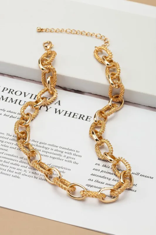 Naomi Gold Chunky Necklace w/ textured/smooth Links sold by Chic Couture