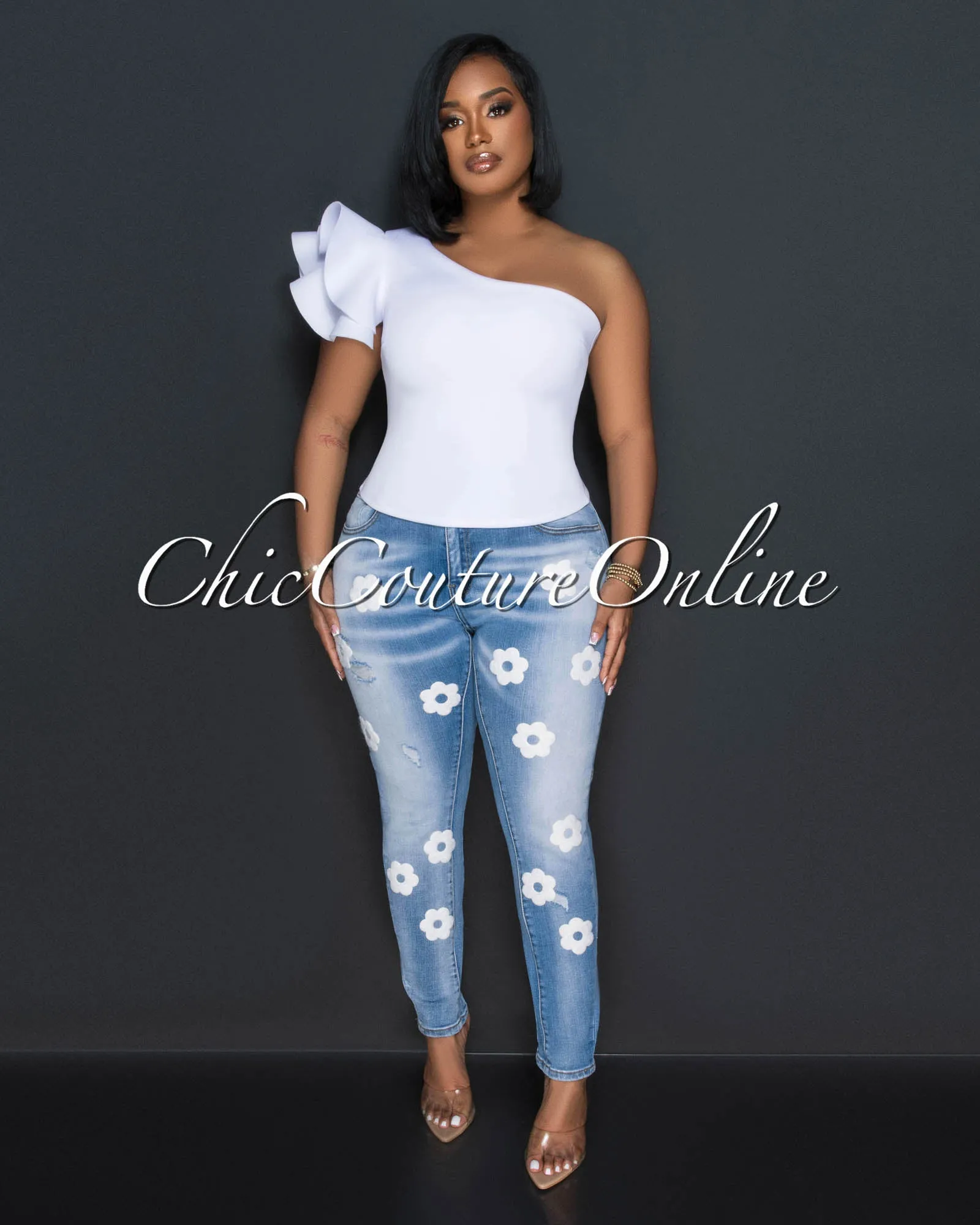 *Jhonnie Light Denim White Flowers Accent Jeans sold by Chic Couture