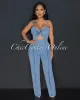 Velicia Light Denim Bust Knot Jumpsuit sold by Chic Couture