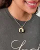 Pearl Horseshoe Charm sold by Clare Vivier