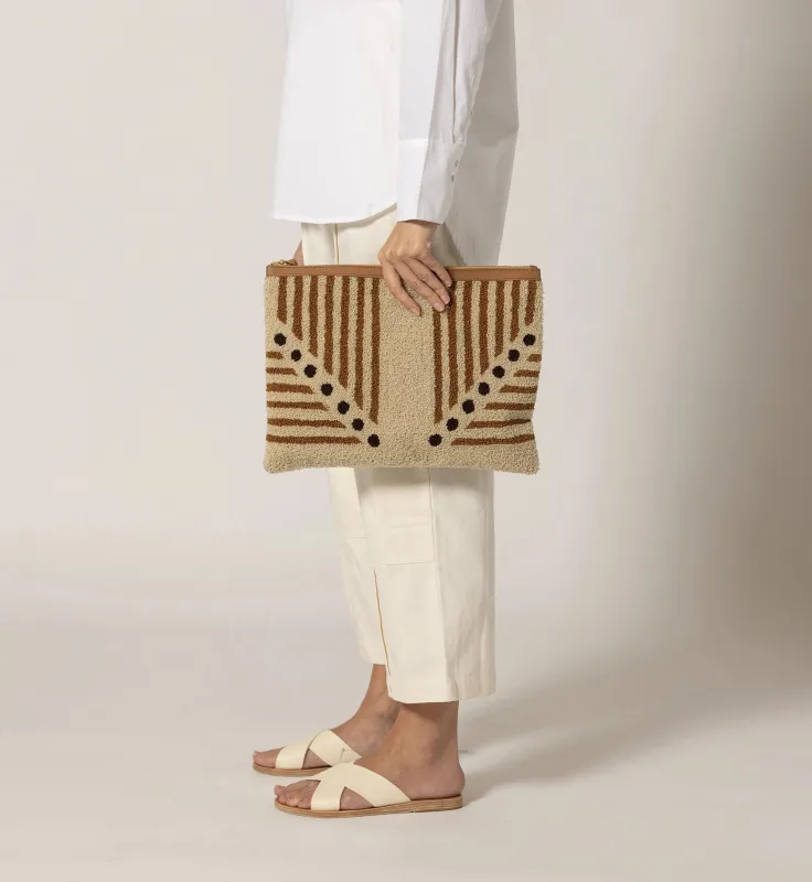Lusso Stripe Clutch sold by Cleobella