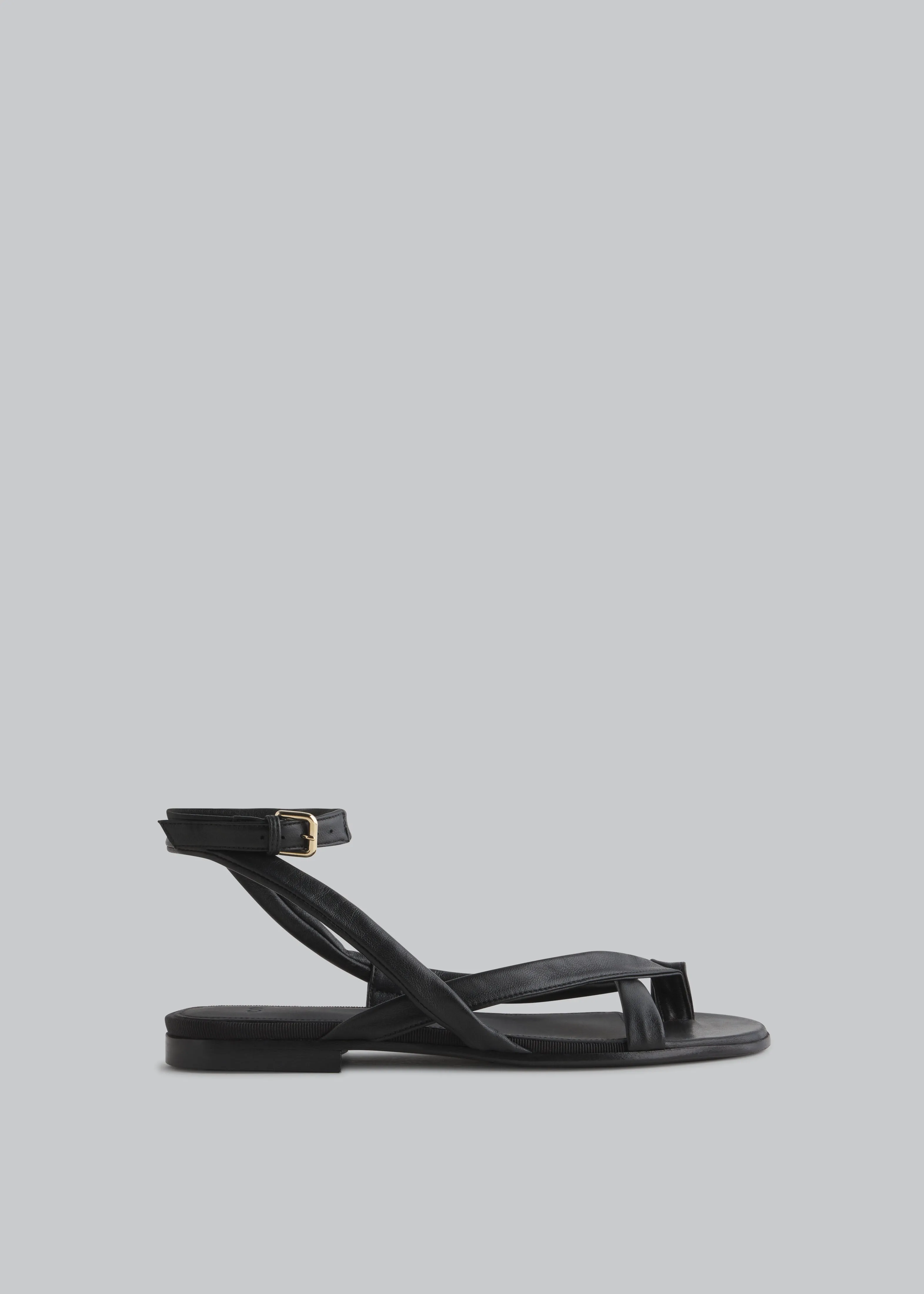 Stretch Leather Toe Strap Sandal in Black sold by CO