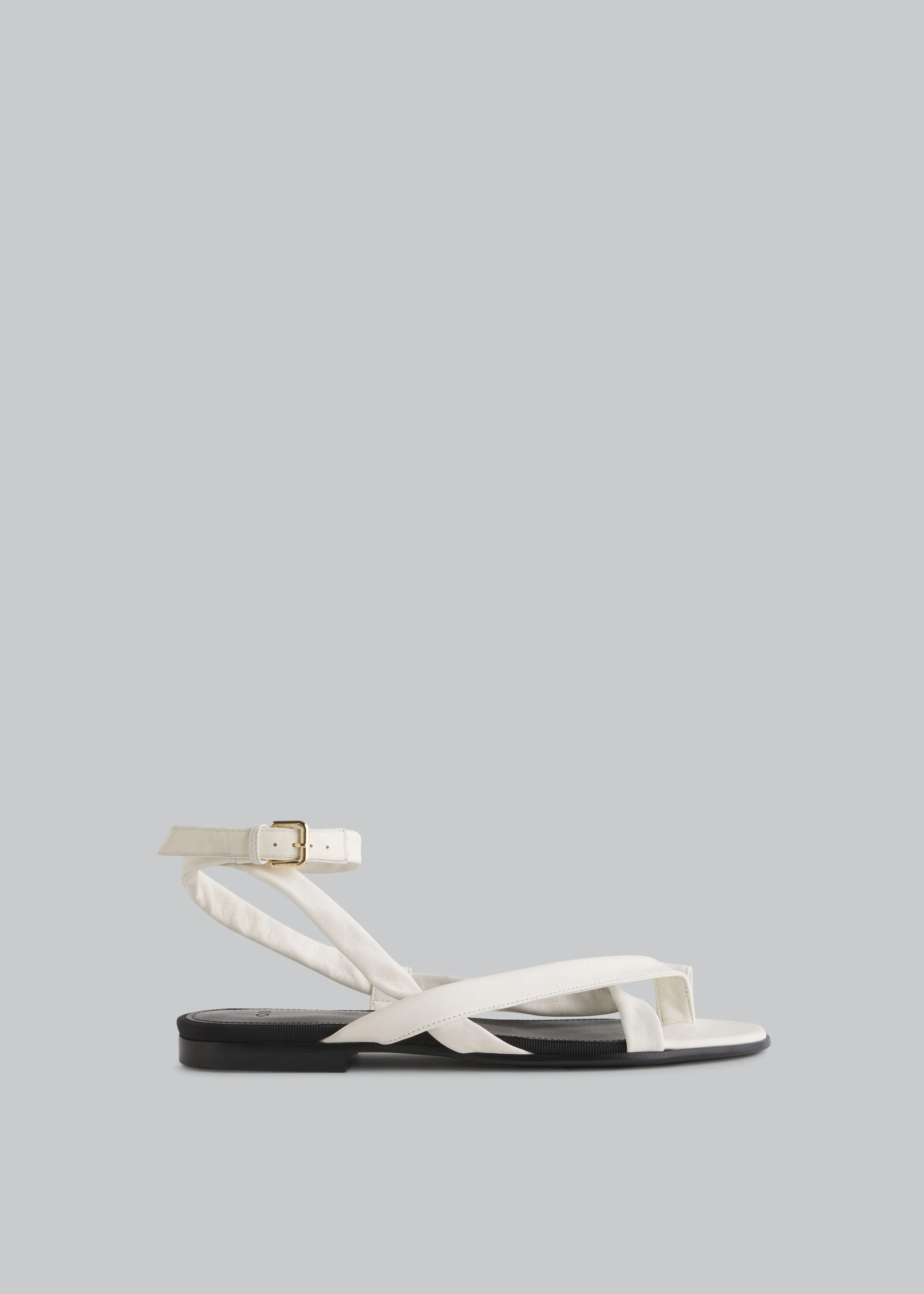 Stretch Leather Toe Strap Sandal in Ivory sold by CO