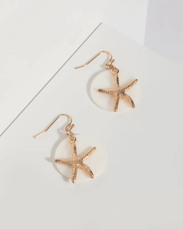 Gold Metal Starfish Drop Earrings sold by Collete Hayman