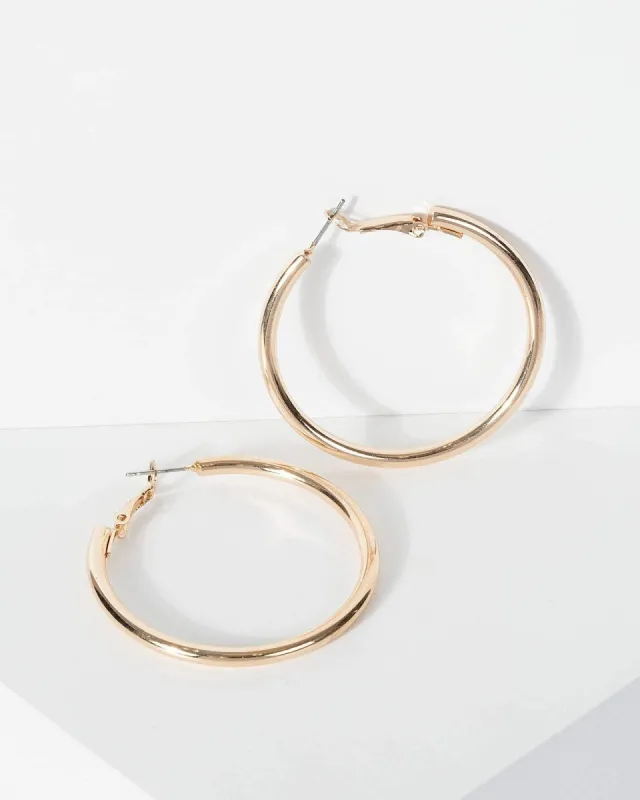 Gold Chunky Mid Hoop Earrings sold by Collete Hayman