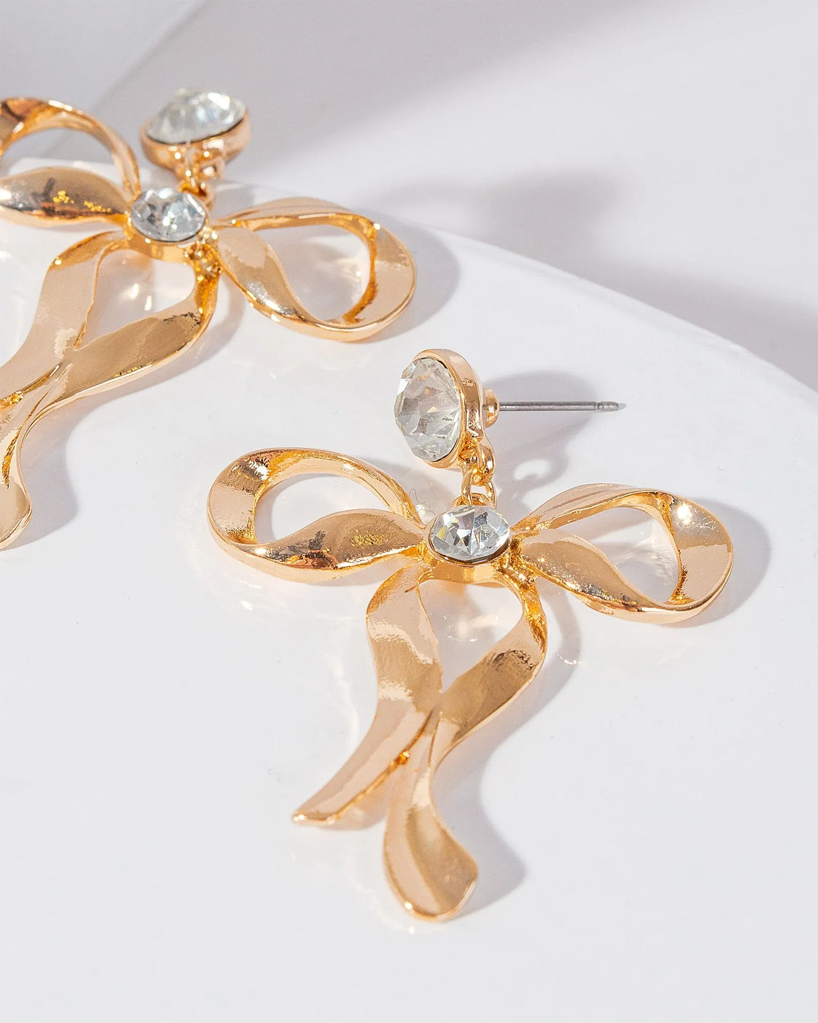 Gold Metal Bow Drop Earrings sold by Collete Hayman product image thumbnail 2