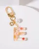 E - Initial Bag Charm Pearl sold by Collete Hayman