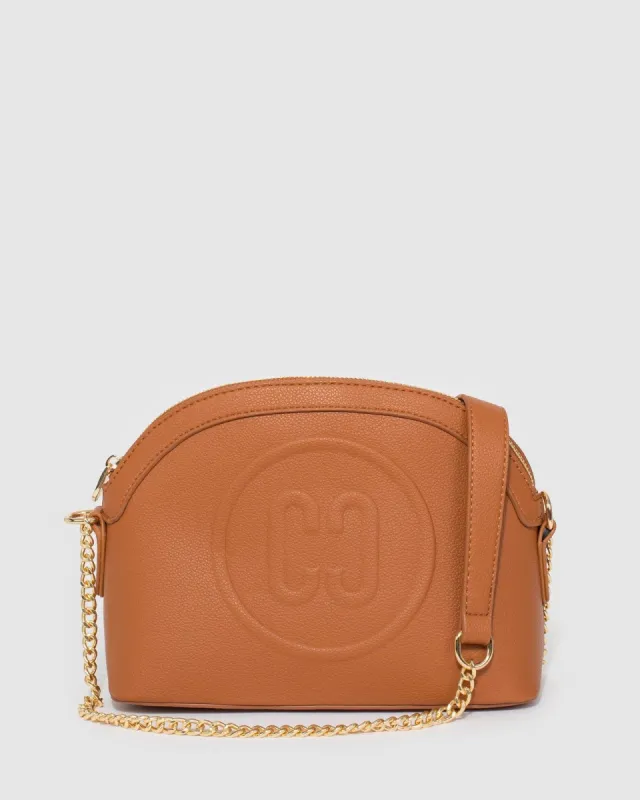 Tan Raina Embossed Crossbody Bag sold by Collete Hayman