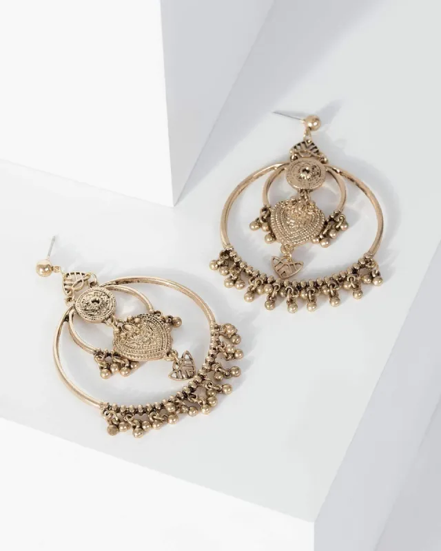 Gold Patterned Disc Festival Circle Earrings sold by Collete Hayman