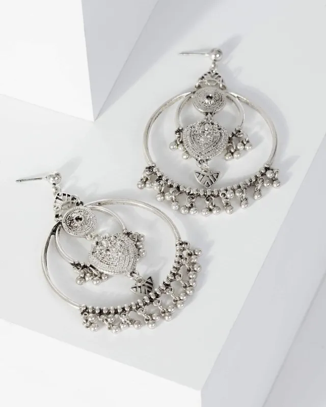 Silver Patterned Disc Festival Circle Earrings sold by Collete Hayman