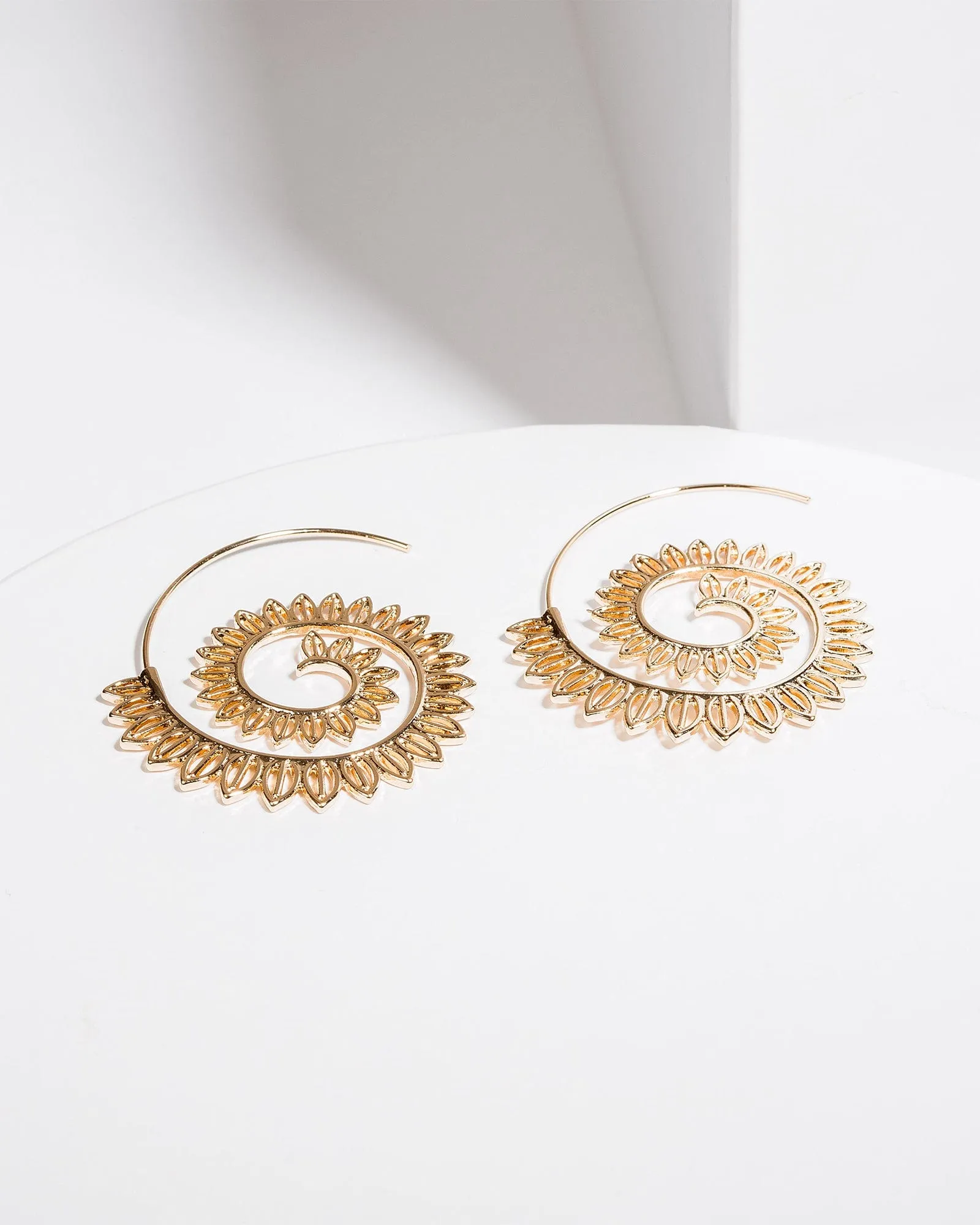 Gold Radiating Spiral Hoop Earrings sold by Collete Hayman