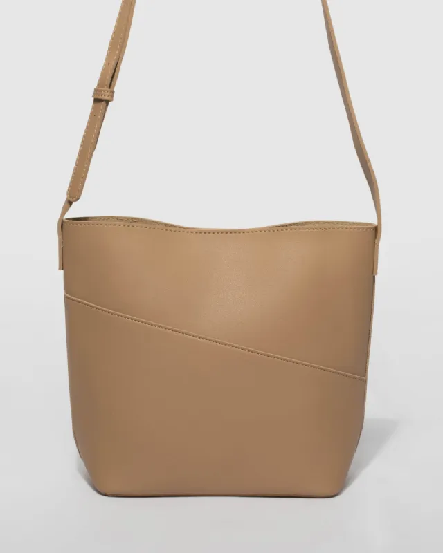 Beige Selena Pouch Crossbody Bag sold by Collete Hayman