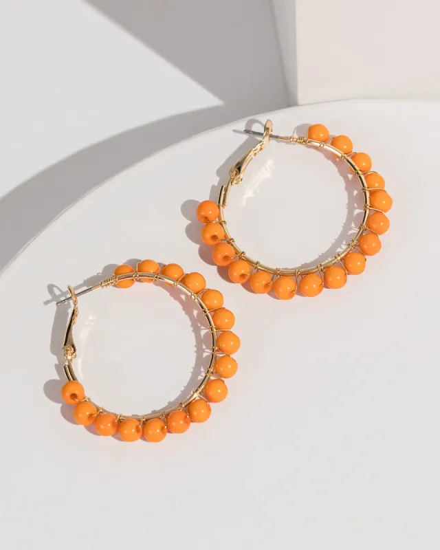 Orange Beaded Wrapped Hoop Earrings sold by Collete Hayman