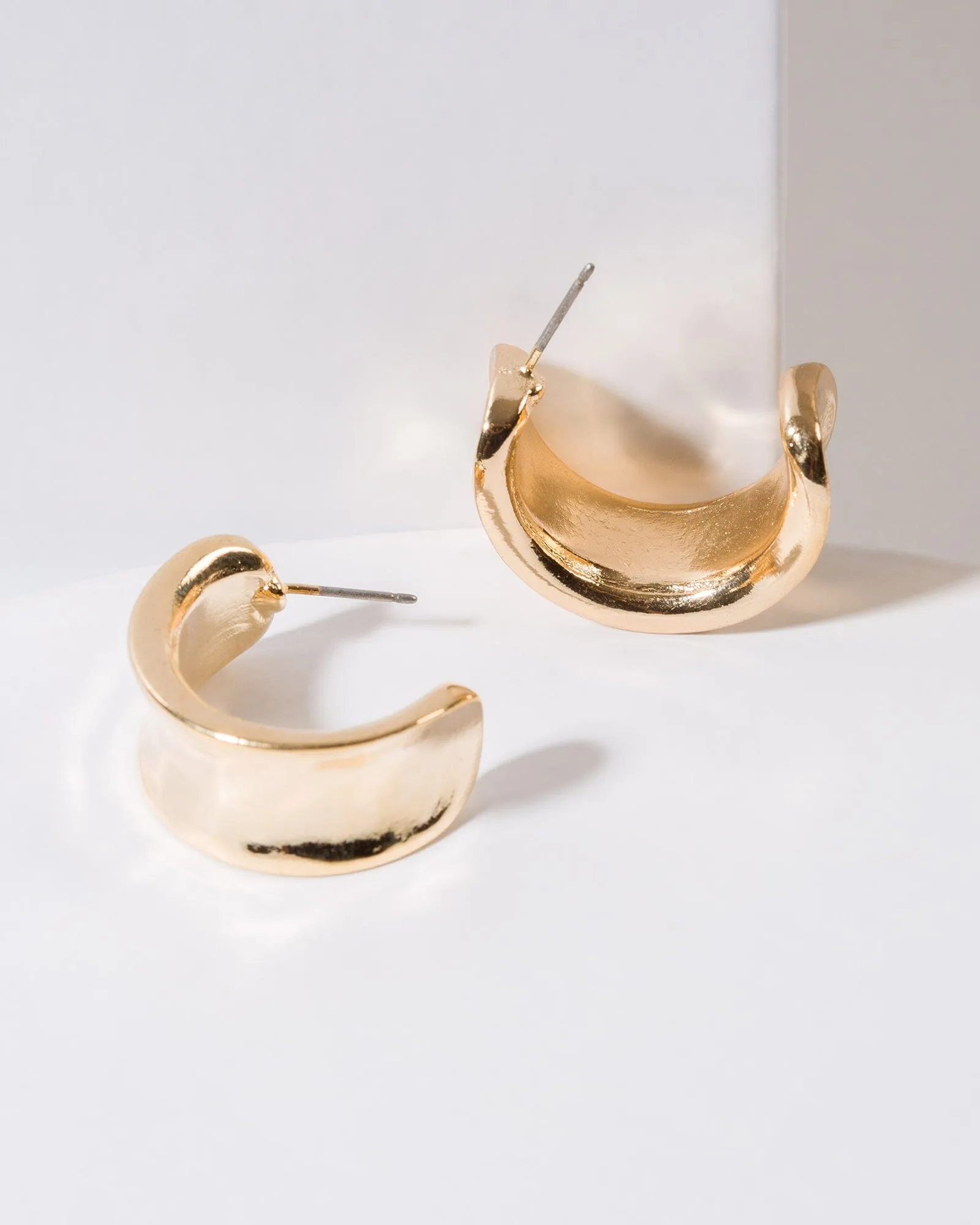 Gold Curved Statement Stud Earrings sold by Collete Hayman