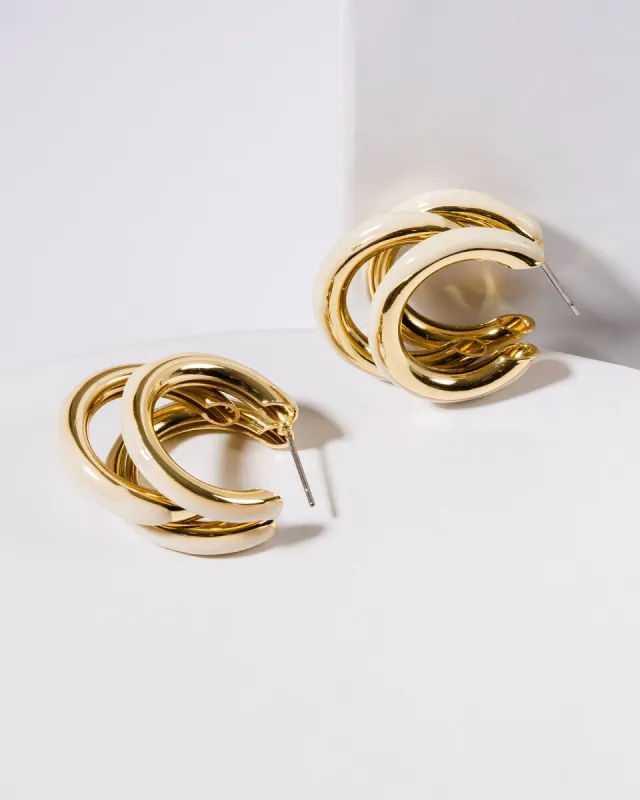 White Triple Huggie Hoop Earrings sold by Collete Hayman