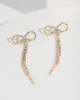 Gold Loop Tassel Earrings sold by Collete Hayman