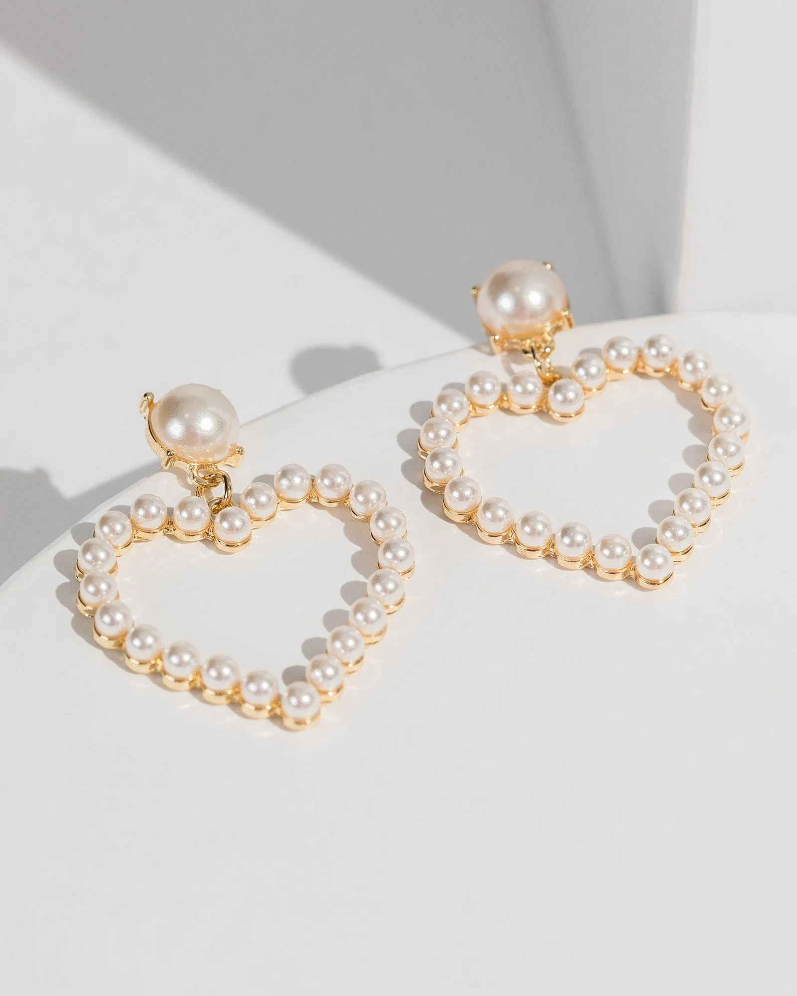 White Heart Pearl Earrings sold by Collete Hayman