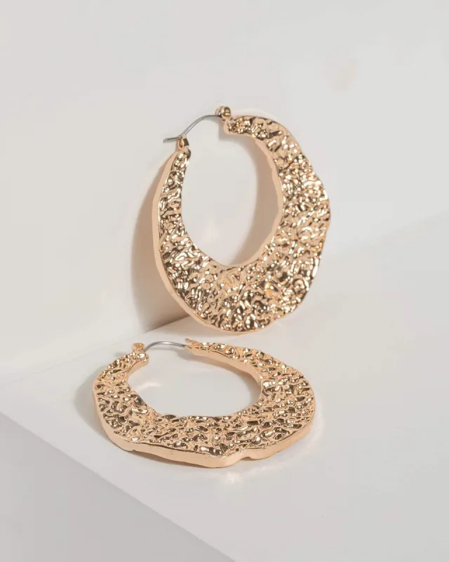 Gold Hammered Hoop Earrings sold by Collete Hayman
