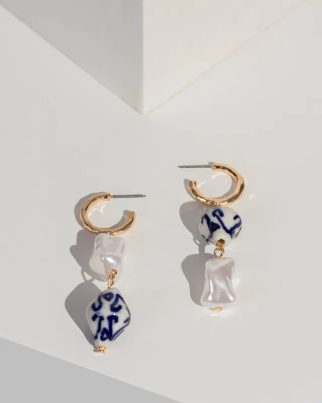 Blue Pearl Beaded Huggie Hoop Earrings sold by Collete Hayman