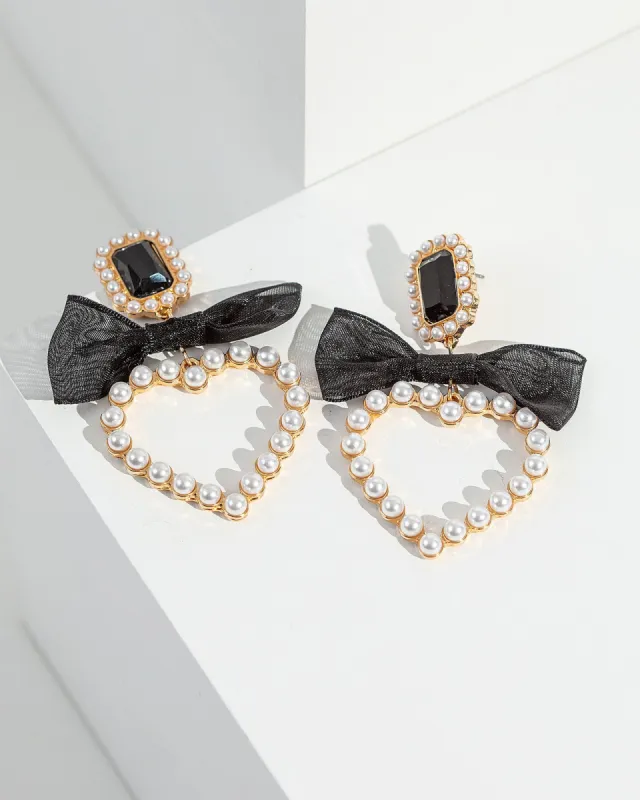 White Bow Pearl Heart Earrings sold by Collete Hayman