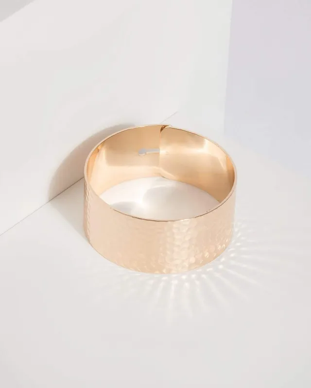 Gold Hammered Metal Bangle sold by Collete Hayman