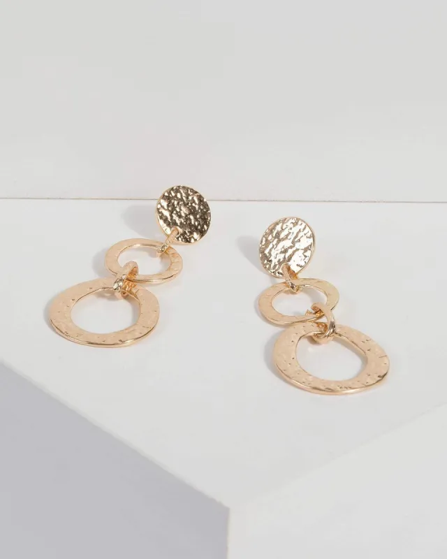 Gold Hammered Metal Drop Earrings sold by Collete Hayman
