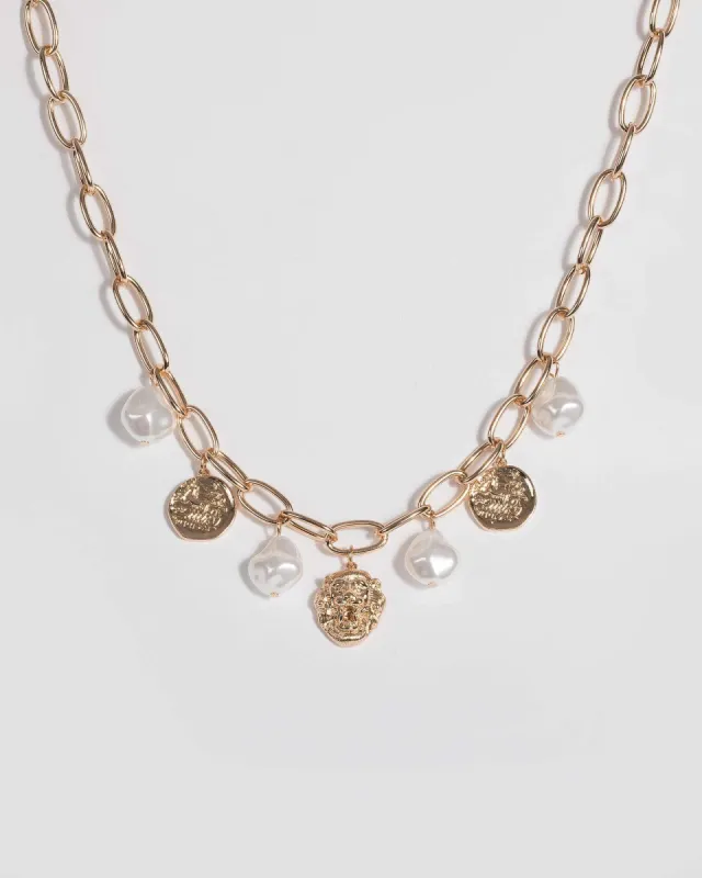 Gold Pearl and Lion Pendant Necklace sold by Collete Hayman