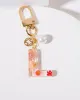 L - Initial Bag Charm Pearl sold by Collete Hayman
