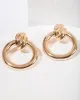 Gold Knotted Door Knocker Earrings sold by Collete Hayman