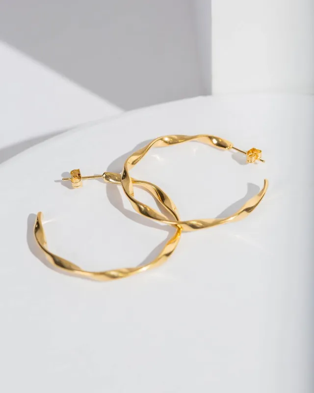 Gold Wavy Hoop Earrings sold by Collete Hayman