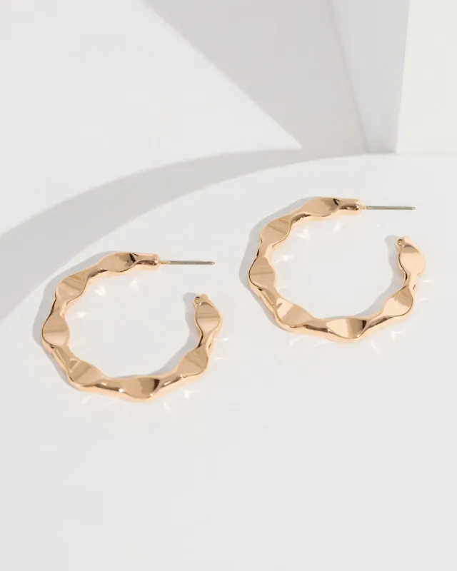 Gold Wavy Hoops Earrings sold by Collete Hayman