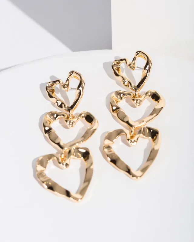 Gold Triple Heart Drop Earrings sold by Collete Hayman
