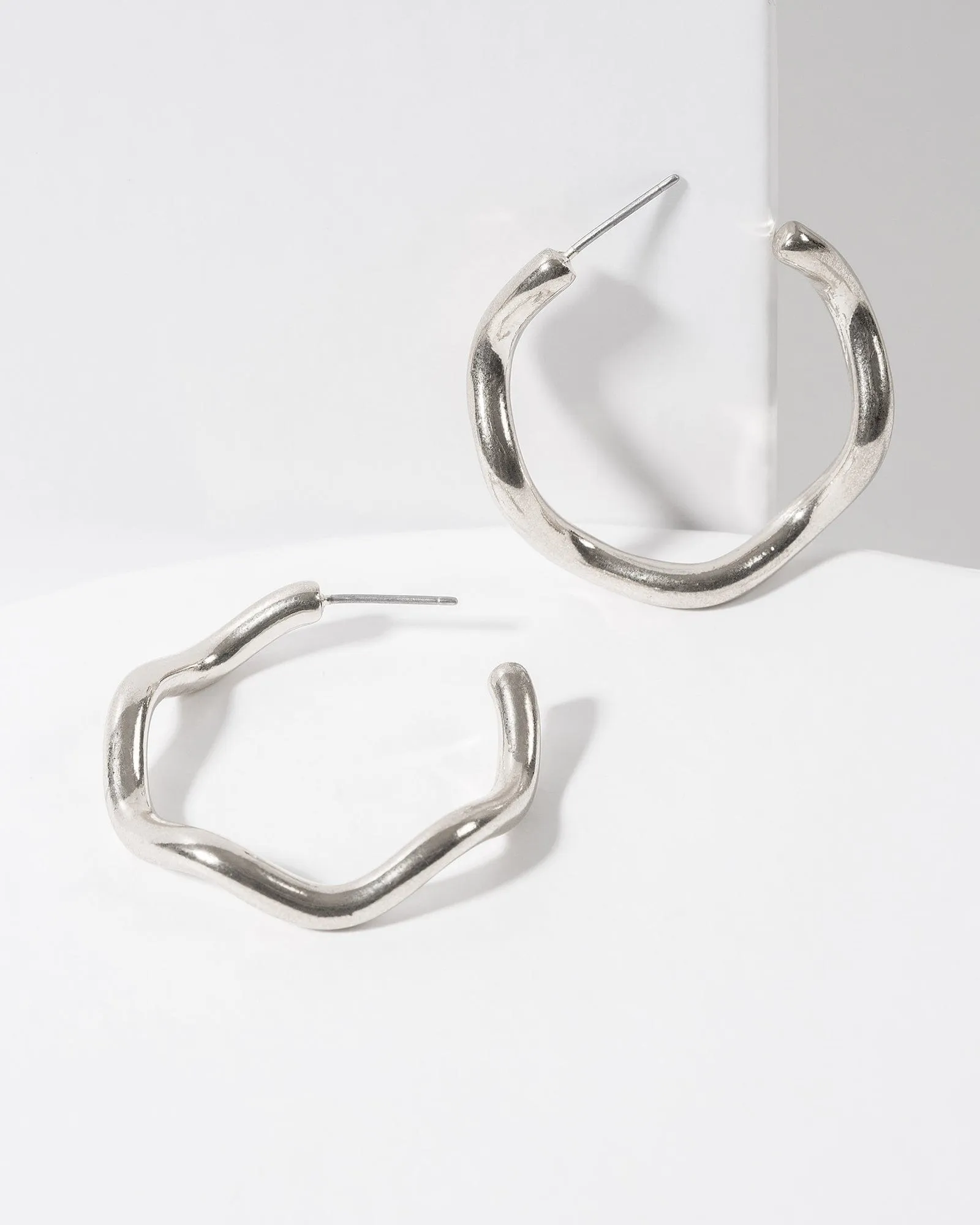 Silver Wavy Hoop Earrings sold by Collete Hayman