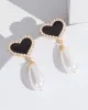 Gold Love Heart Pearl Drop Earrings sold by Collete Hayman