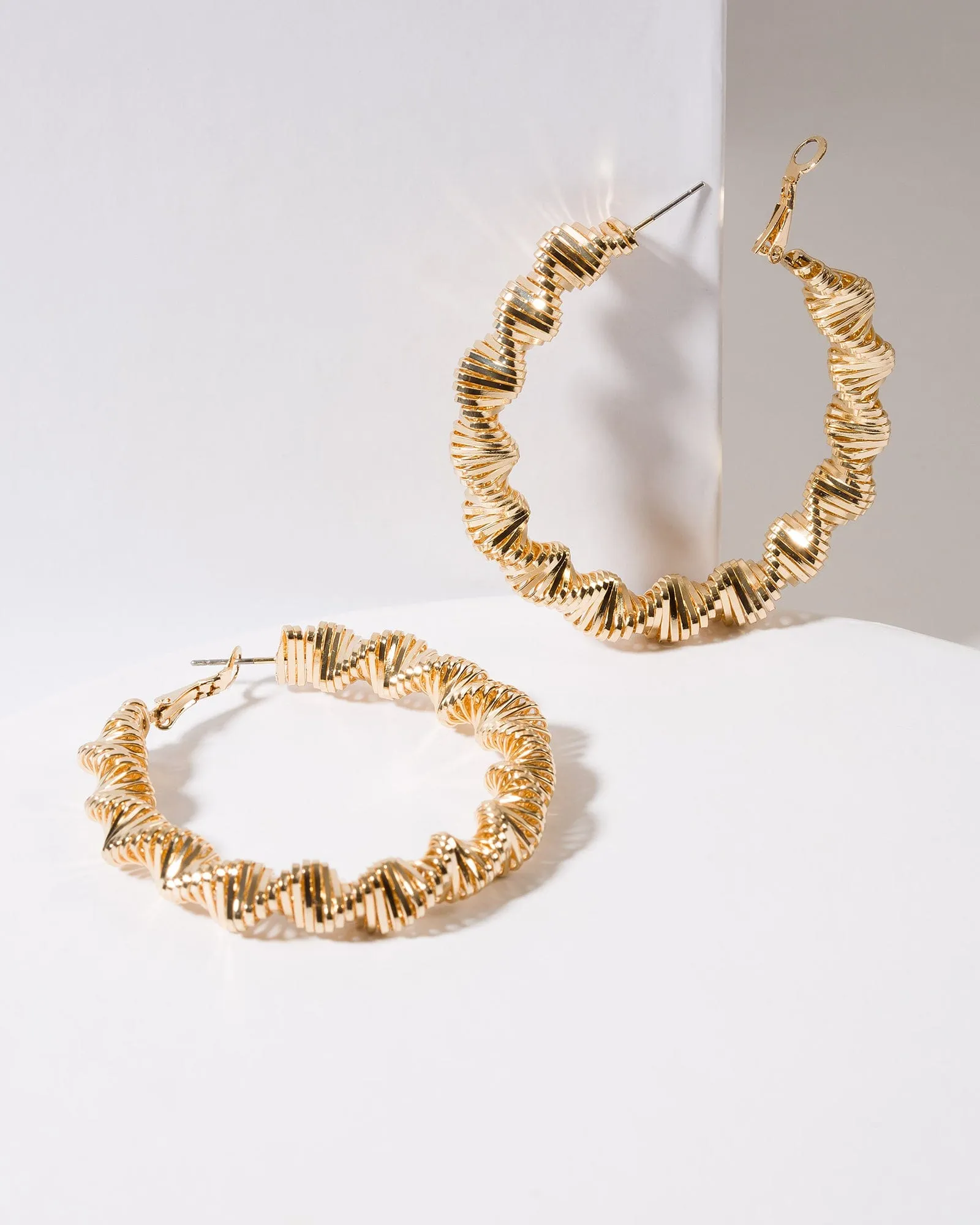 Gold Textured Twisted Hoop Earrings sold by Collete Hayman