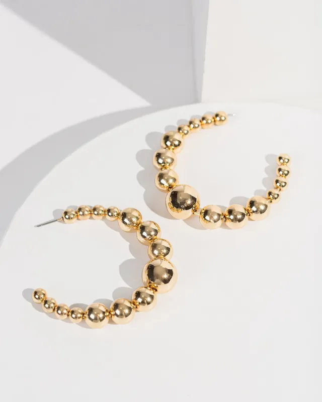 Gold Chunky Beaded Hoop Earrings sold by Collete Hayman