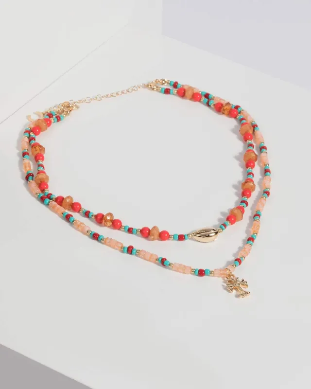 Gold Cross and Coin Beaded Necklace sold by Collete Hayman