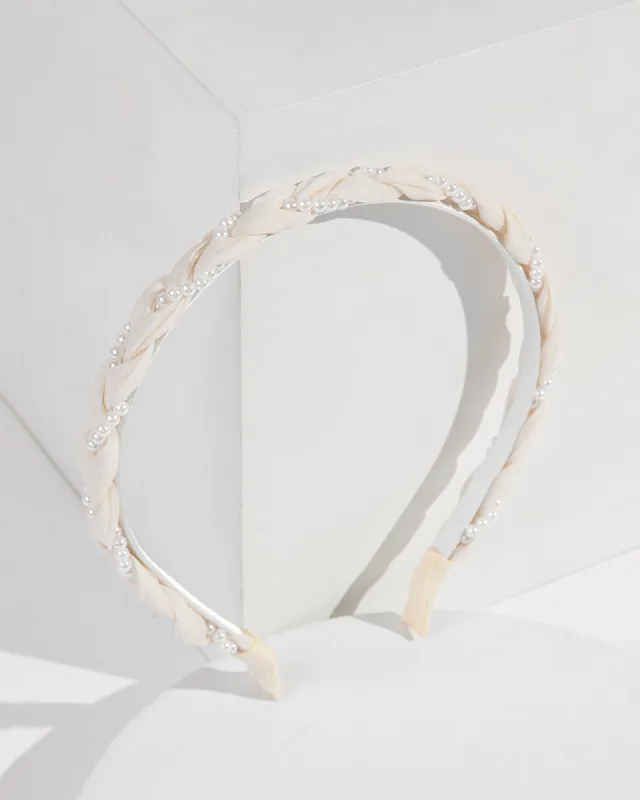 White Fabric And Pearl Twisted Headband sold by Collete Hayman