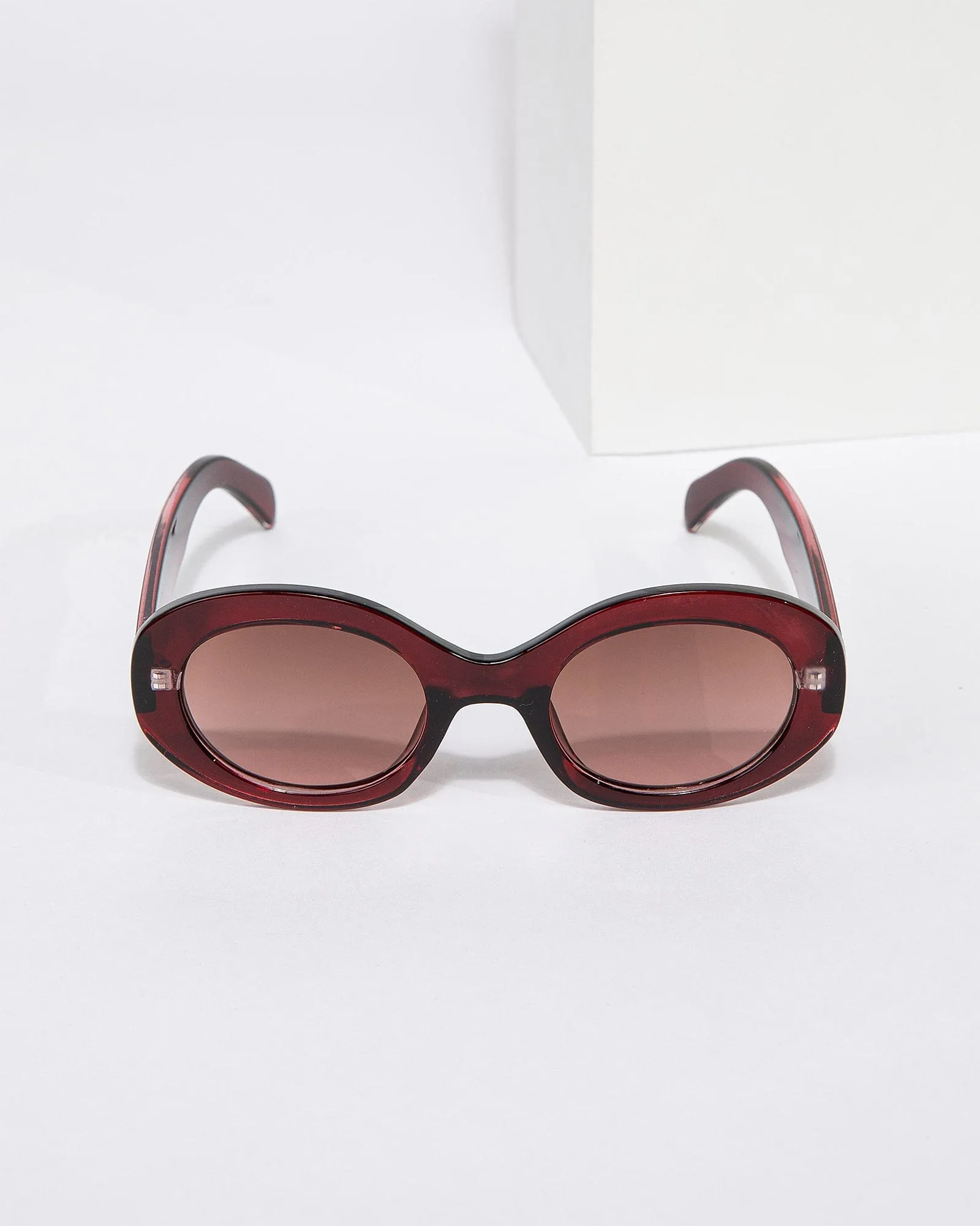 Burgundy Oval Shaped Sunglasses sold by Collete Hayman