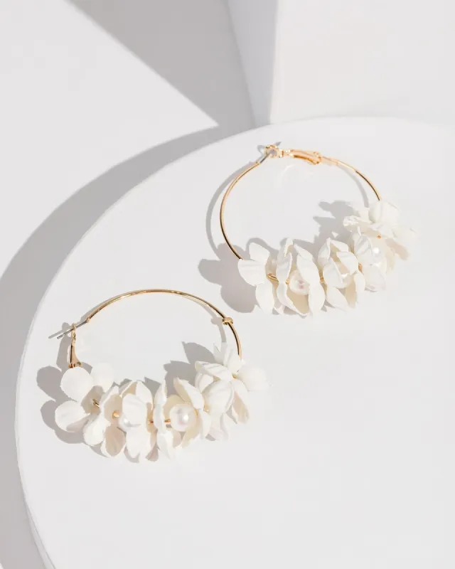 White Flowers Around Hoop Earrings sold by Collete Hayman