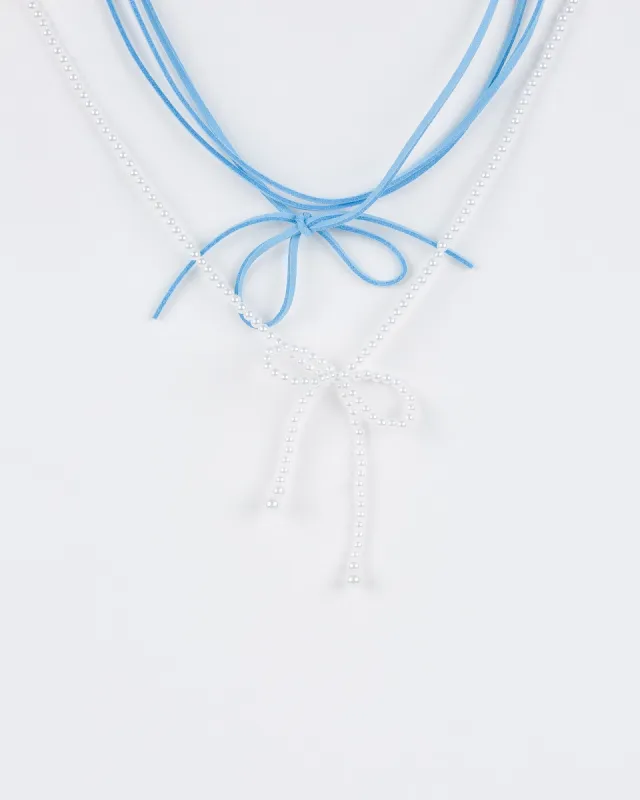 Blue 2 Pack Pearl Bow And String Necklace sold by Collete Hayman