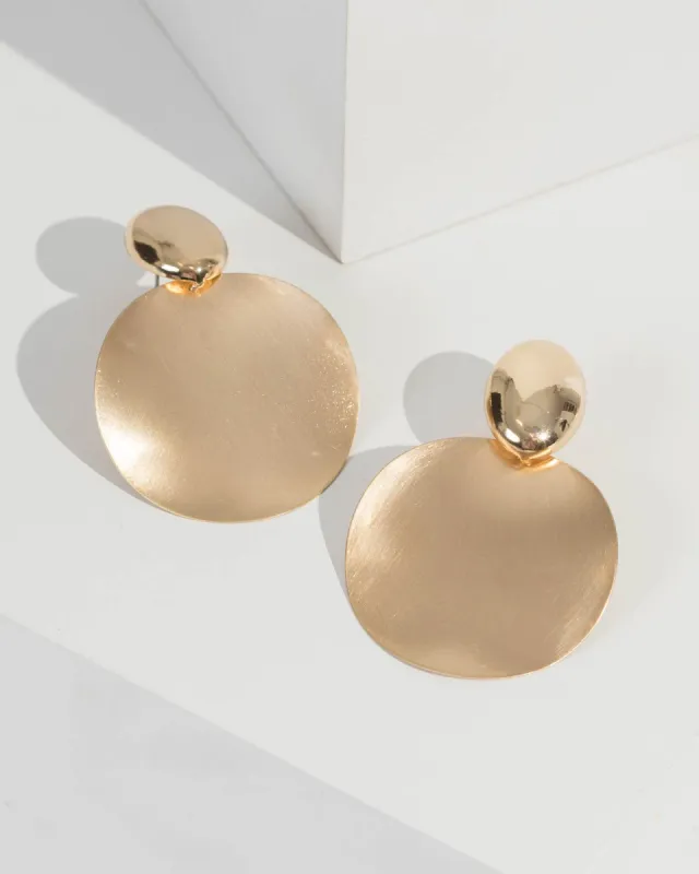 Gold Hammered Metal Disk Earrings sold by Collete Hayman