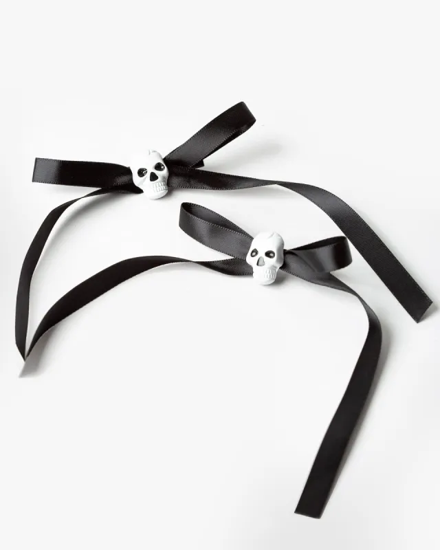 Black 2 Pack Skull Bow Slides sold by Collete Hayman