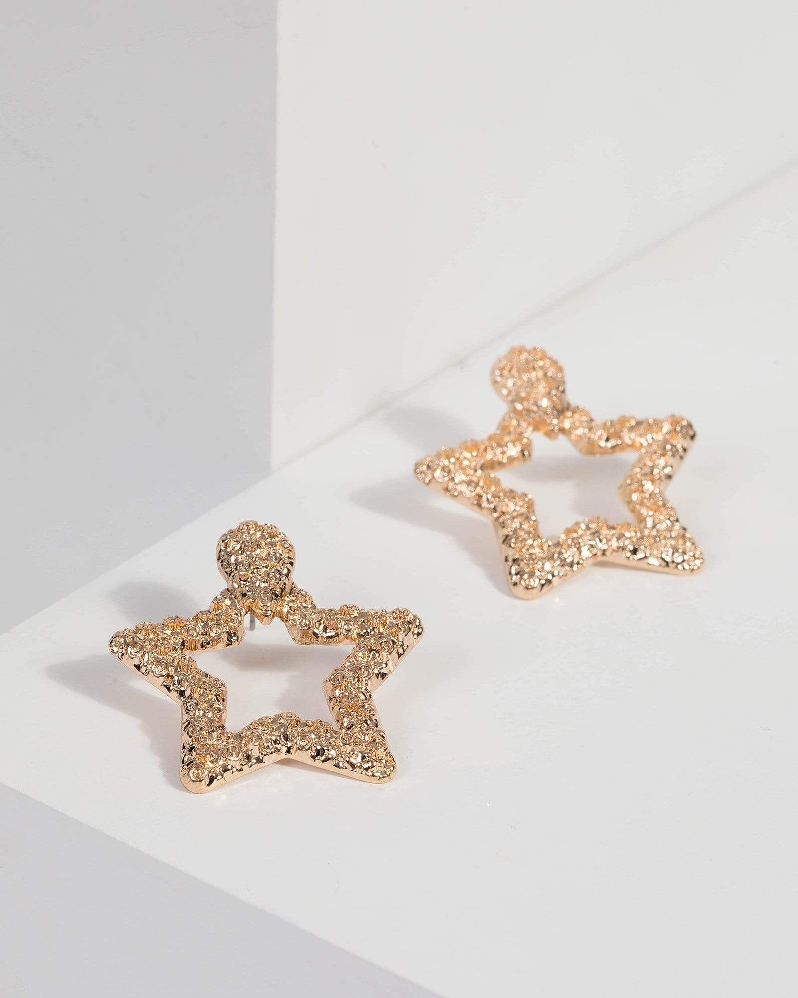 Gold Textured Star Earrings sold by Collete Hayman