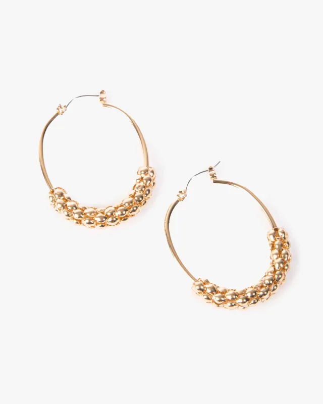 Gold Textured Oval Hoop Earrings sold by Collete Hayman