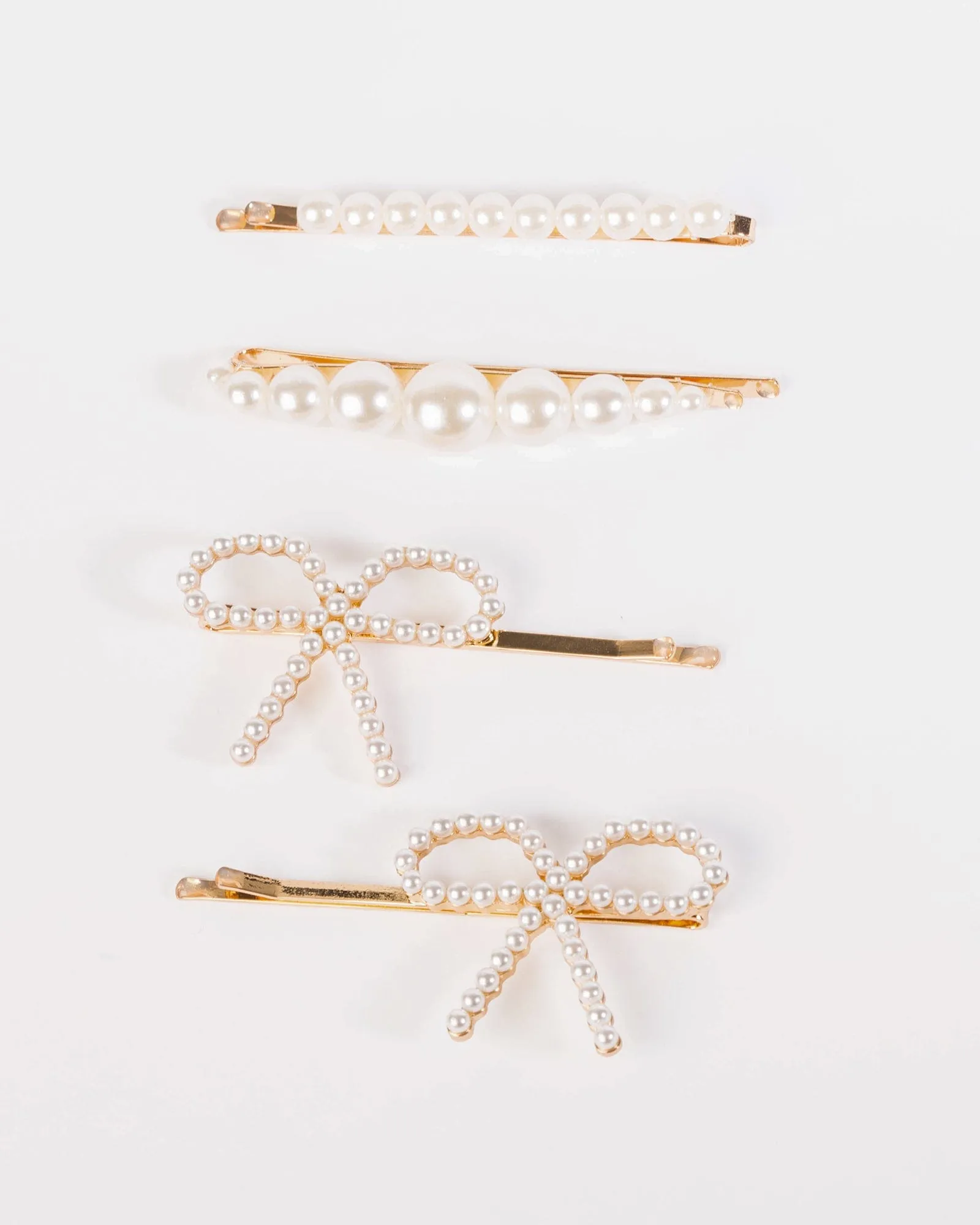 Pearl 4 Pack Bow Hair Slides sold by Collete Hayman