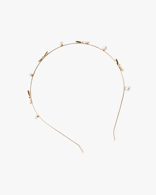 Gold Metal Bow And Pearl Heabdand sold by Collete Hayman