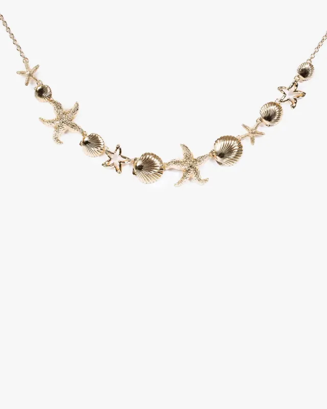 Gold Beach Charm Necklace sold by Collete Hayman