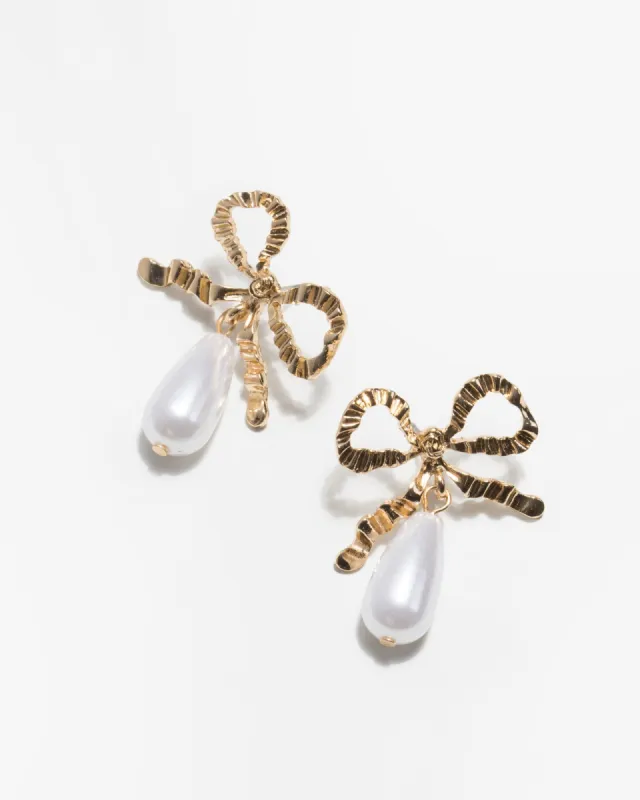 Gold Textured Bow Pearl Drop Earrings sold by Collete Hayman